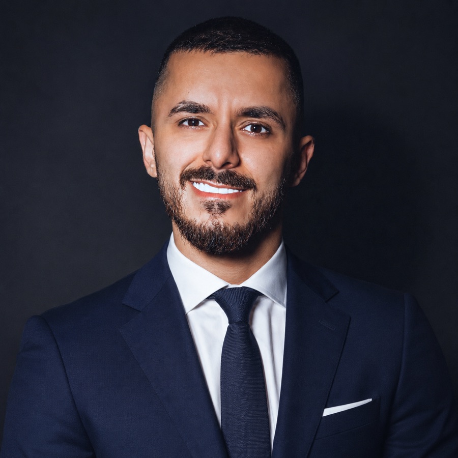 Teacher Rami in a navy suit